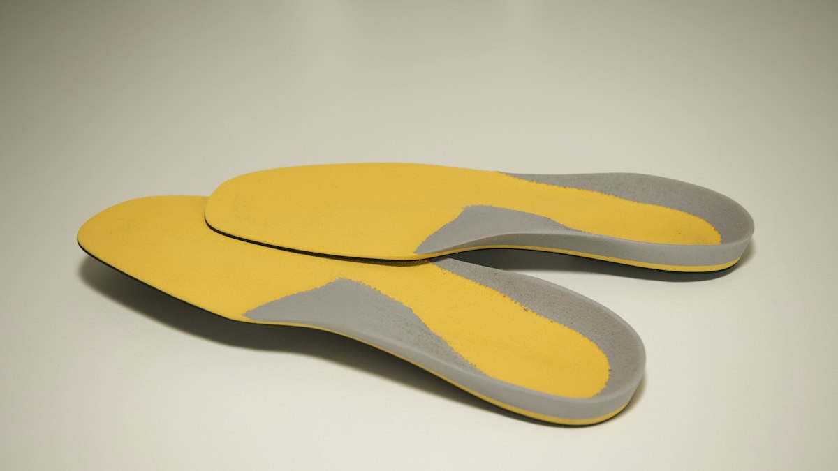 Detailed visual breakdown of Orthotic Insoles, Medial Wedges, and Heel Counter Enhancements - Footwear Adjustments for Ankle Stability and Arch Support